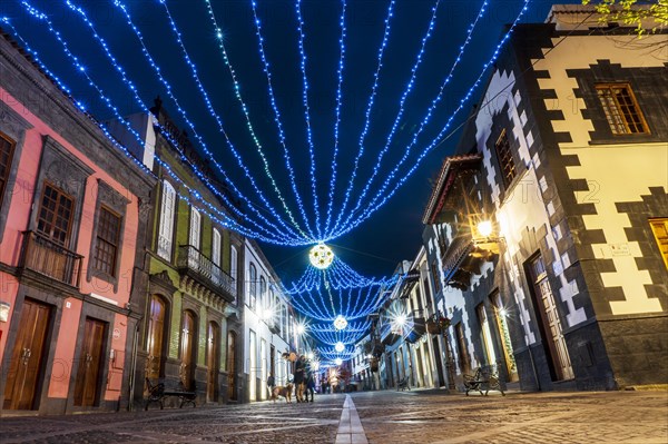 Illuminated main street in historic Teror