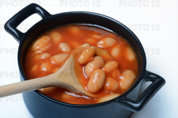 White beans with tomato sauce in pots