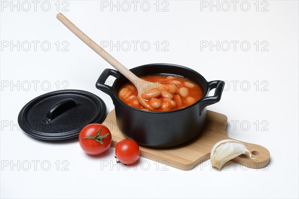 White beans with tomato sauce in pots