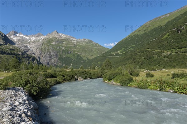 Landscape of the Rhone Valley with the Rhone River in front of the massif of the Rhone Glacier