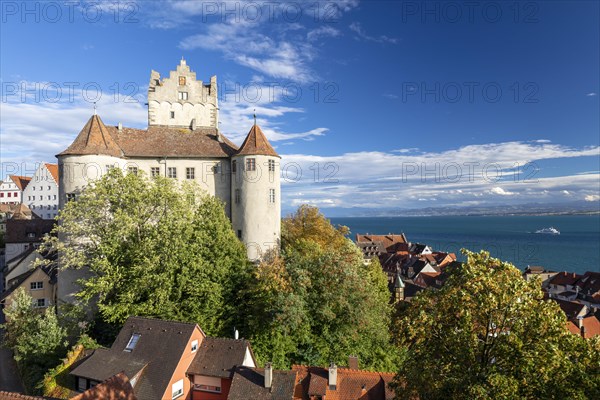 Meersburg Castle in the sunshine with a view of the Alps