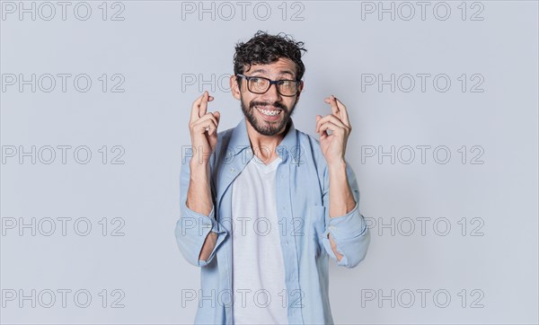 Happy man making a wish