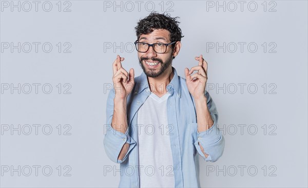 Happy man making a wish