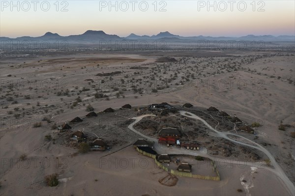 The Doro Nawas Camp and arid desert plains at the edge of the dry river bed of the Aba-Huab river