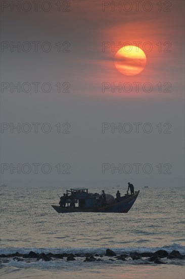 Fishing boats at sunrise