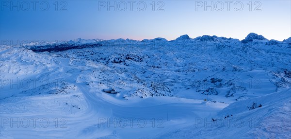 Evening atmosphere in snowy winter landscape