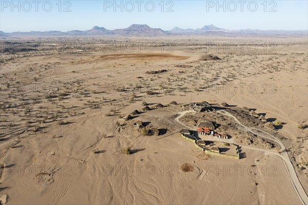 The Doro Nawas Camp and arid desert plains at the edge of the dry river bed of the Aba-Huab river