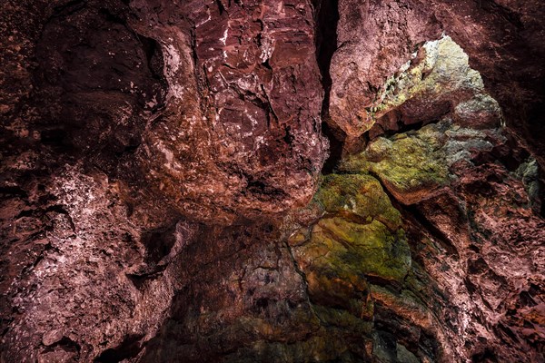 Colourfully illuminated areas of the Cueva de los Verdes