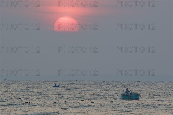 Fishing boats at sunrise