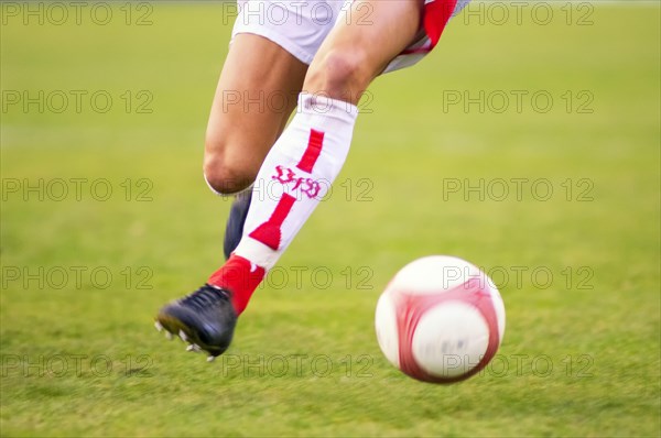 Legs of a running football player