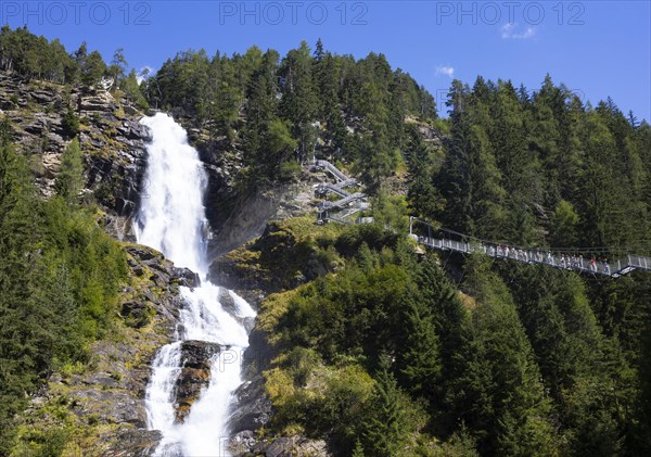 Hiking trail over a suspension bridge along the Stuibenfall near Umhausen