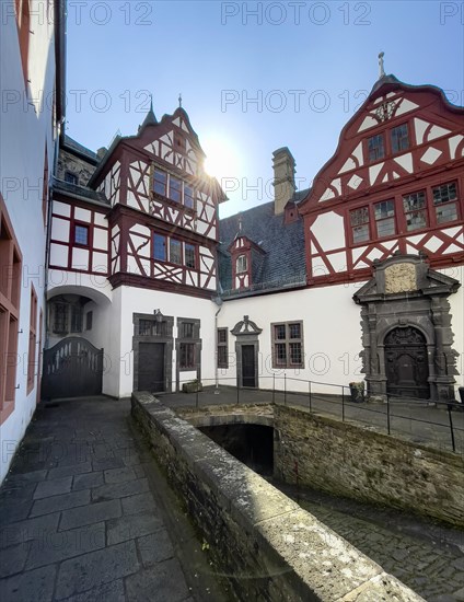 View from castle courtyard to buildings of Trier Castle in double castle Buerresheim from Middle Ages