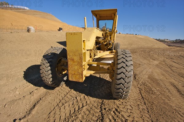 Tractor at a construction site and dirt lot