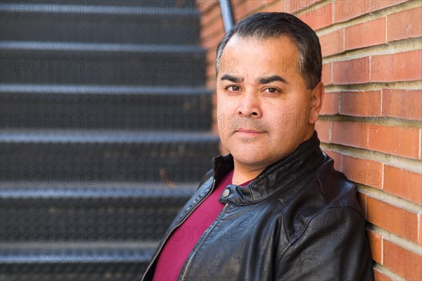 Headshot portrait of handsom hispanic man