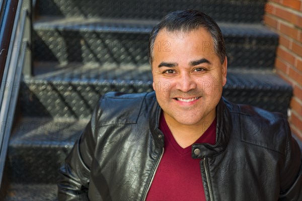 Headshot portrait of handsom hispanic man