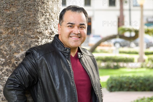 Headshot portrait of handsom hispanic man