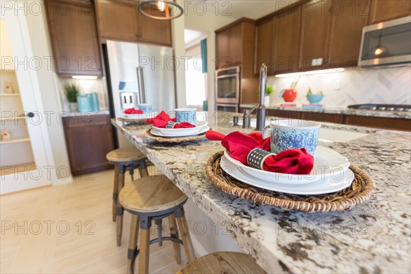 Abstract of beautiful kitchen granite counter place settings and chairs