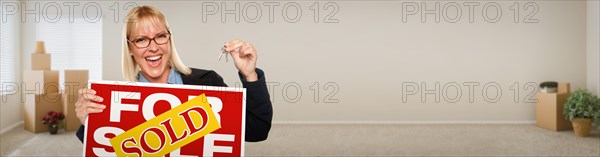 Banner of adult woman inside room with boxes holding house keys and sold for sale real estate sign