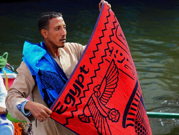 Souvenir seller with a rowing boat on the Nile