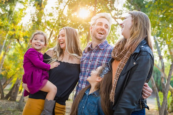 mixed-race family members having fun outdoors