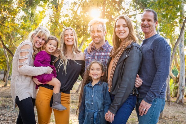 Multigenerational mixed-race family portrait outdoors