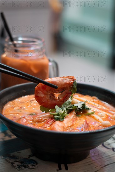 Tom Yum Kung seafood soup in a restaurant