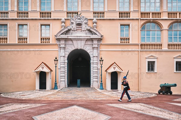 Motion blurred marching sentry guard in front of entrance of Prince's Palace of Monaco