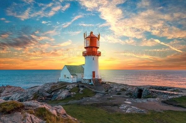 Lighthouse surrounded by rocks at sunset - Photo12-imageBROKER-Isai ...