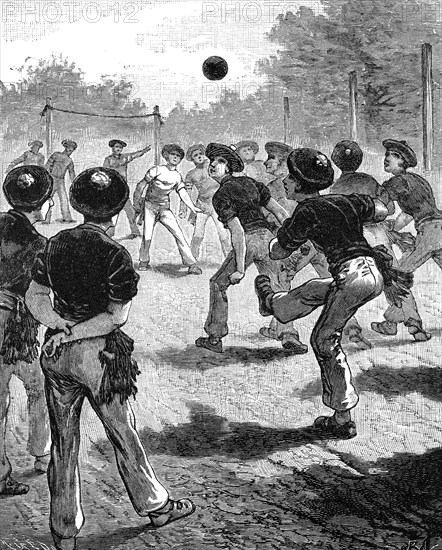 Young men playing football at a sports ground in London in 1870