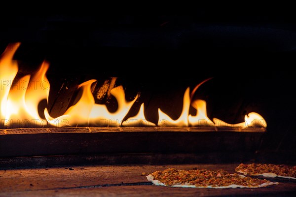 The yellow flames in a stone oven in display