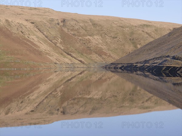 Banks of reservoir reflected in water - Photo12-imageBROKER-Mike Lane