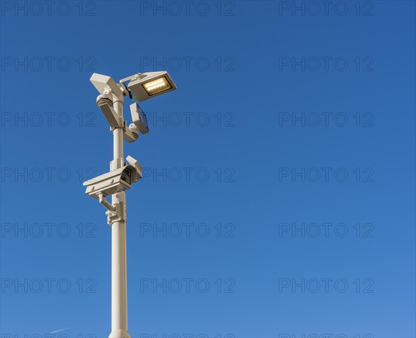 Light pole with surveillance camera