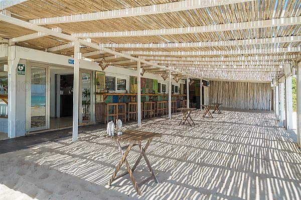 Empty terrace at beach bar Chiringuito Ponderosa Beach, Can Picafort