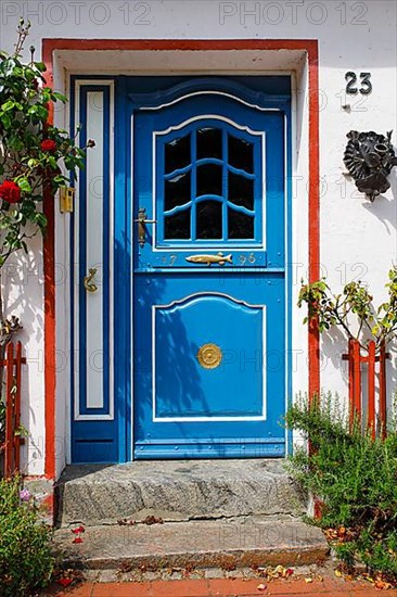 Old fisherman's house from 1796 with decorative wooden door, Historic fishing settlement Holm