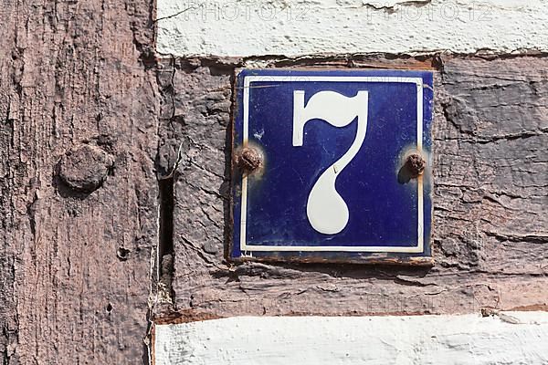 House number sign, number seven on an old half-timbered house