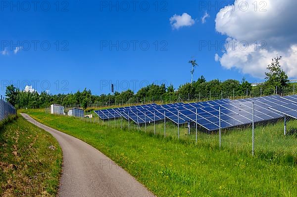 A photovoltaic system with protective fence, also PV system