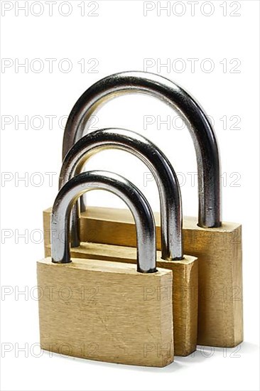 Three padlocks of different size isolated on white