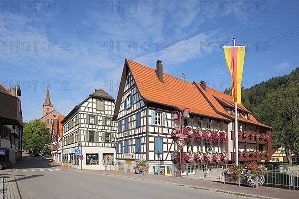 Half-timbered houses with town church in the main street