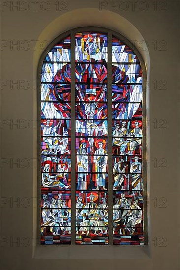 Colourful stained glass window of the neo-Romanesque St. John the Baptist Church in Todtnau