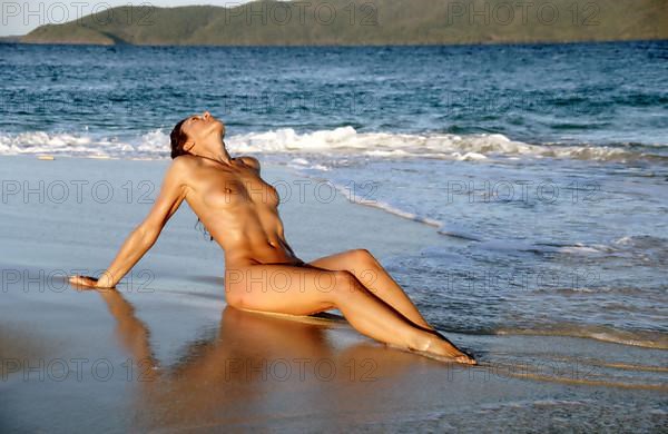 Woman sunbathing on the beach