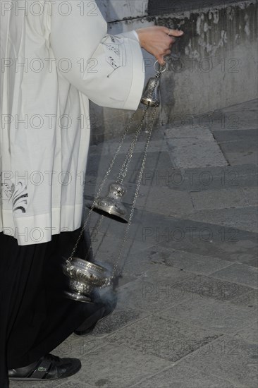 Incense waving altar boy