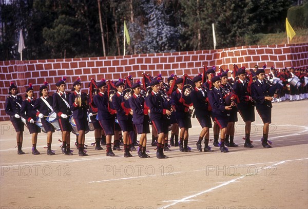 Girl students playing music during Founder's Day Parade