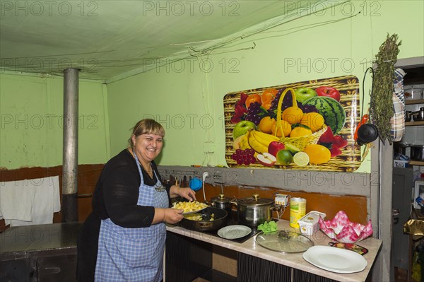 Georgian woman preparing French fries
