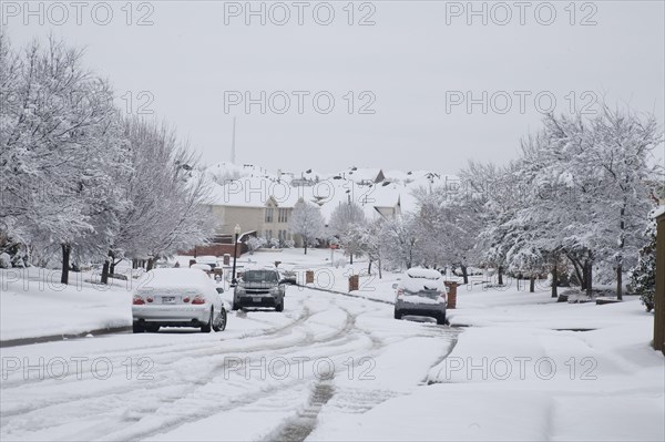 Heavy wet snowfall covering city streets