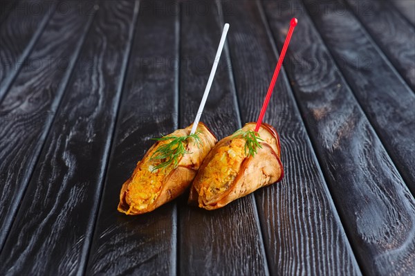 Appetizer for reception. Eggplant stuffed with fried carrot