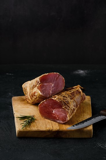 Smoked beef fillet meat on cutting board