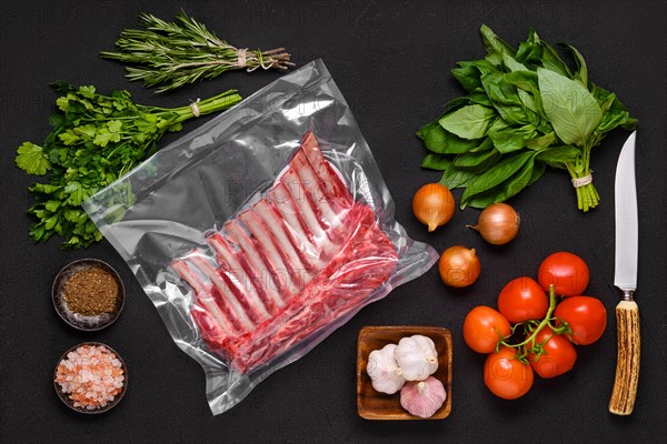 Vacuum sealed lamb ribs with ingredients for cooking