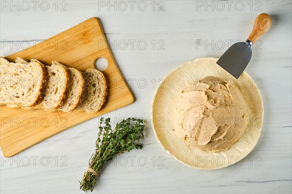 Overhead view of sour curd mixed with spice and herbs for spreading