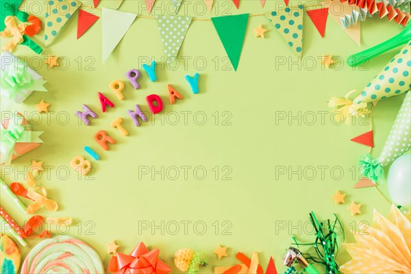 Happy birthday text with accessories green background