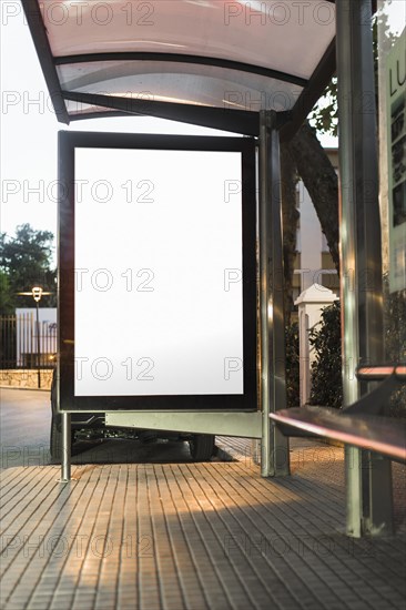 Blank white mockup of bus stop vertical billboard